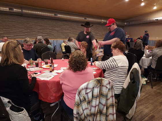 People getting their card checked playing BINGO